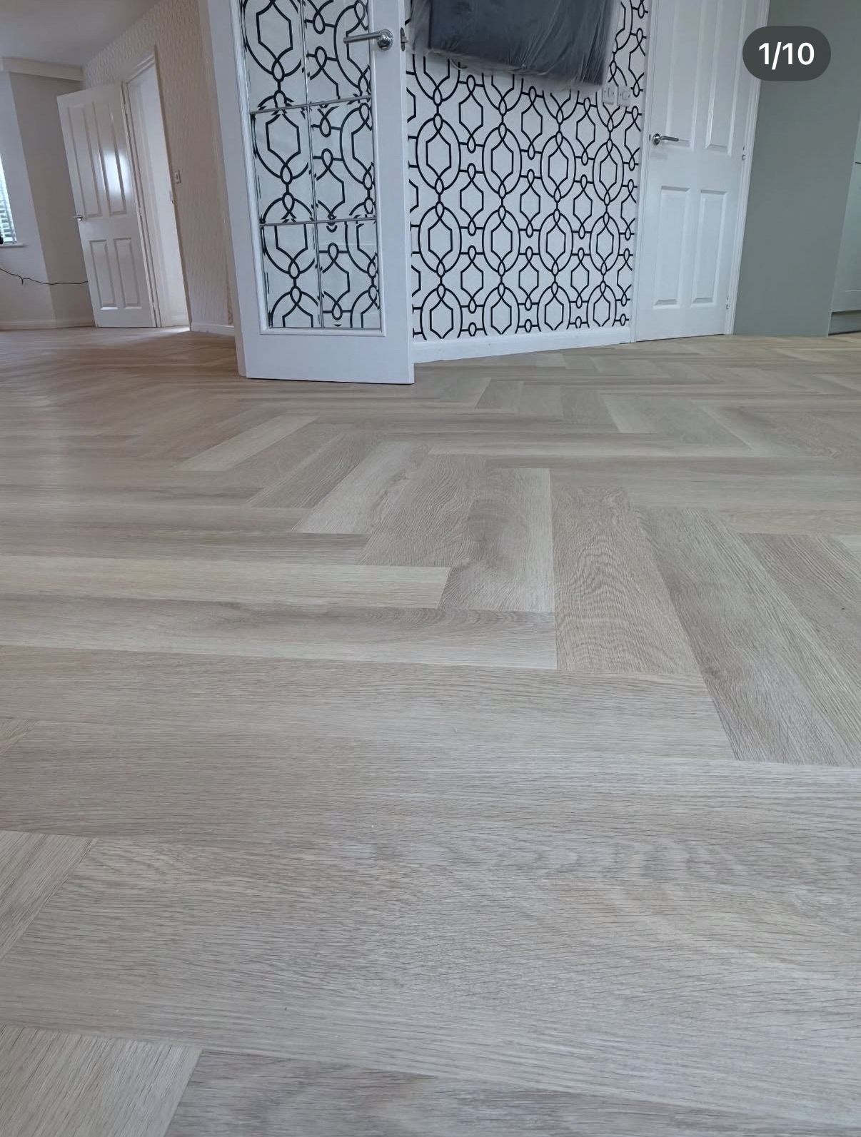 Close up of light herringbone flooring