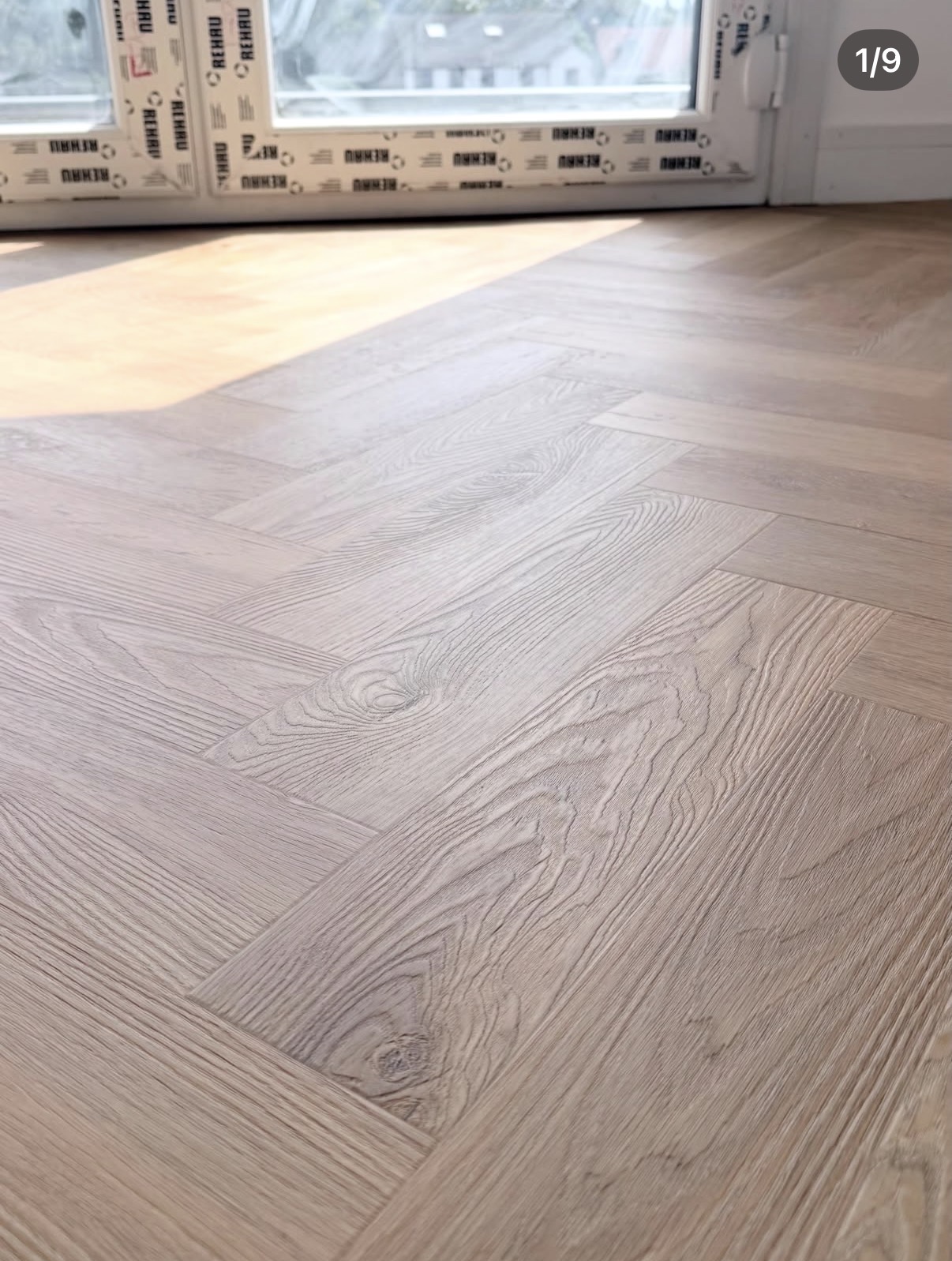 Close-up of wood-effect herringbone flooring