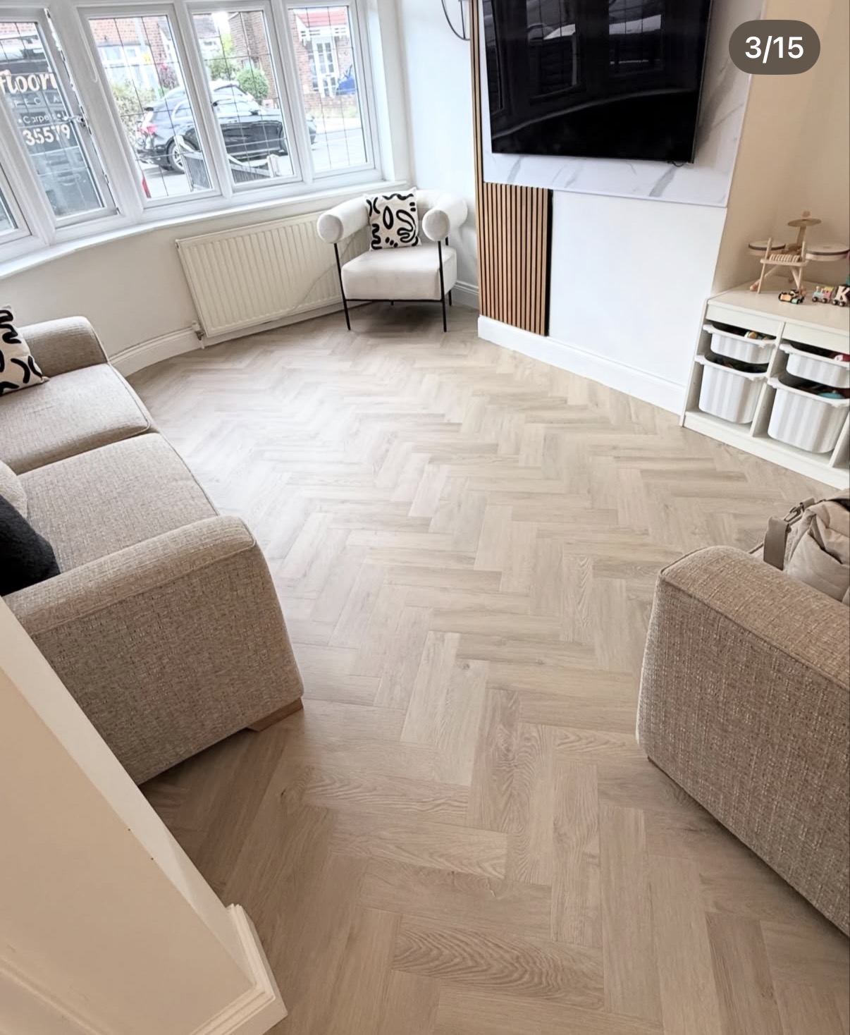 Light herringbone flooring in a living room