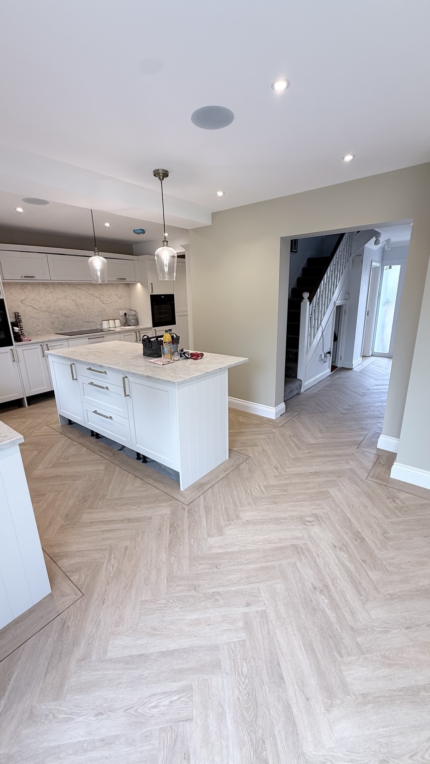 Open plan herringbone flooring with border